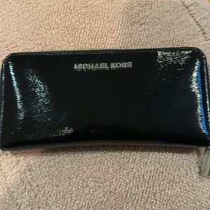 Michael Kors black patten leather wallet. Used